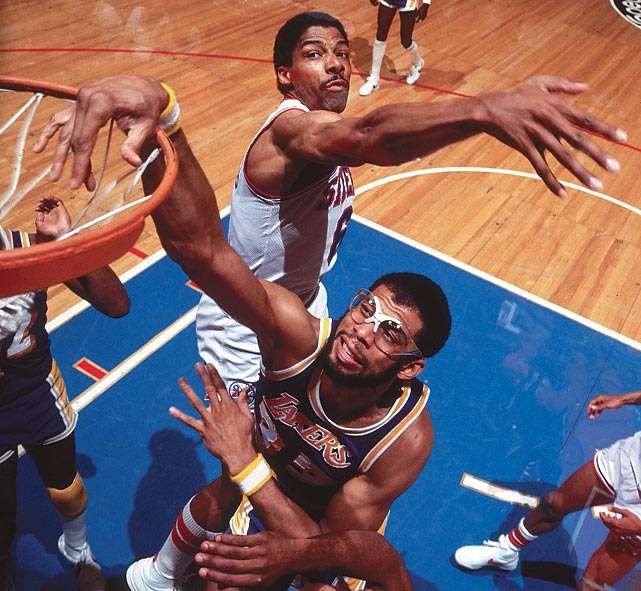 Kareem dunks past Julius Erving in 1982.